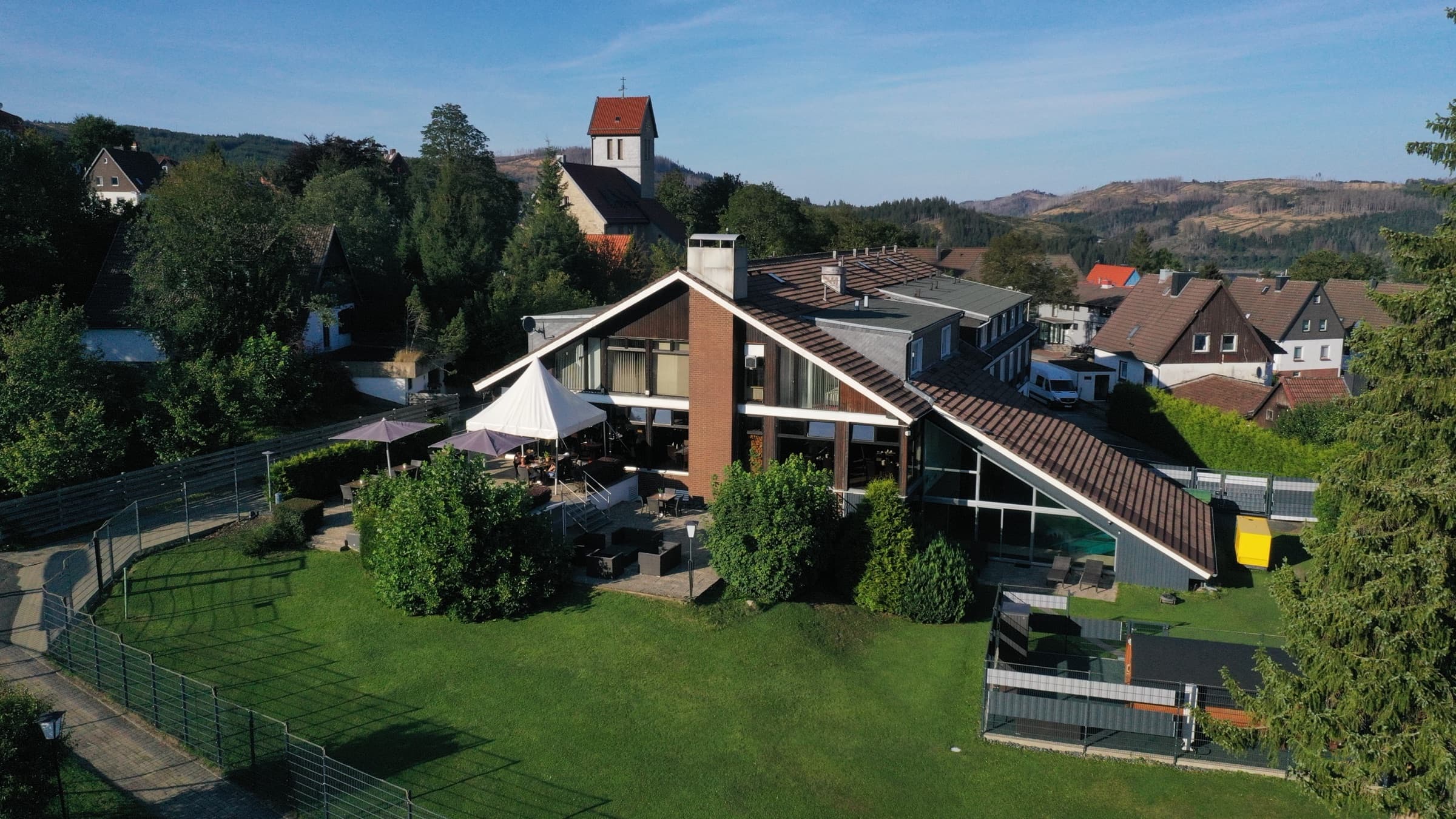 Aerial view of Das Vitalhotel Schulenberg and Lake Oker in the Upper Harz mountains